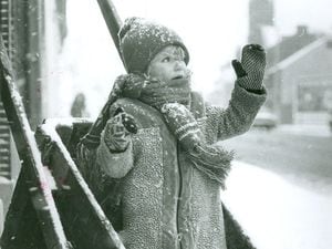 One way to travel... three-year-old Dawn Patten, of Webster Road, Walsall, enjoys playing in the snow which carpeted the streets 20/01/79