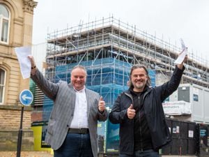 Councillor Stephen Simkins, City of Wolverhampton Council's deputy leader and cabinet member for city economy, and Steve Homer, chief executive officer of AEG Presents, celebrate signing a 25-year deal to operate the Civic Halls.