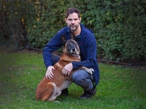 Kai the fire investigation dog, who unexpectedly went blind, has now been diagnosed with a brain tumour. He is pictured with owner and trainer Mat Dixon.