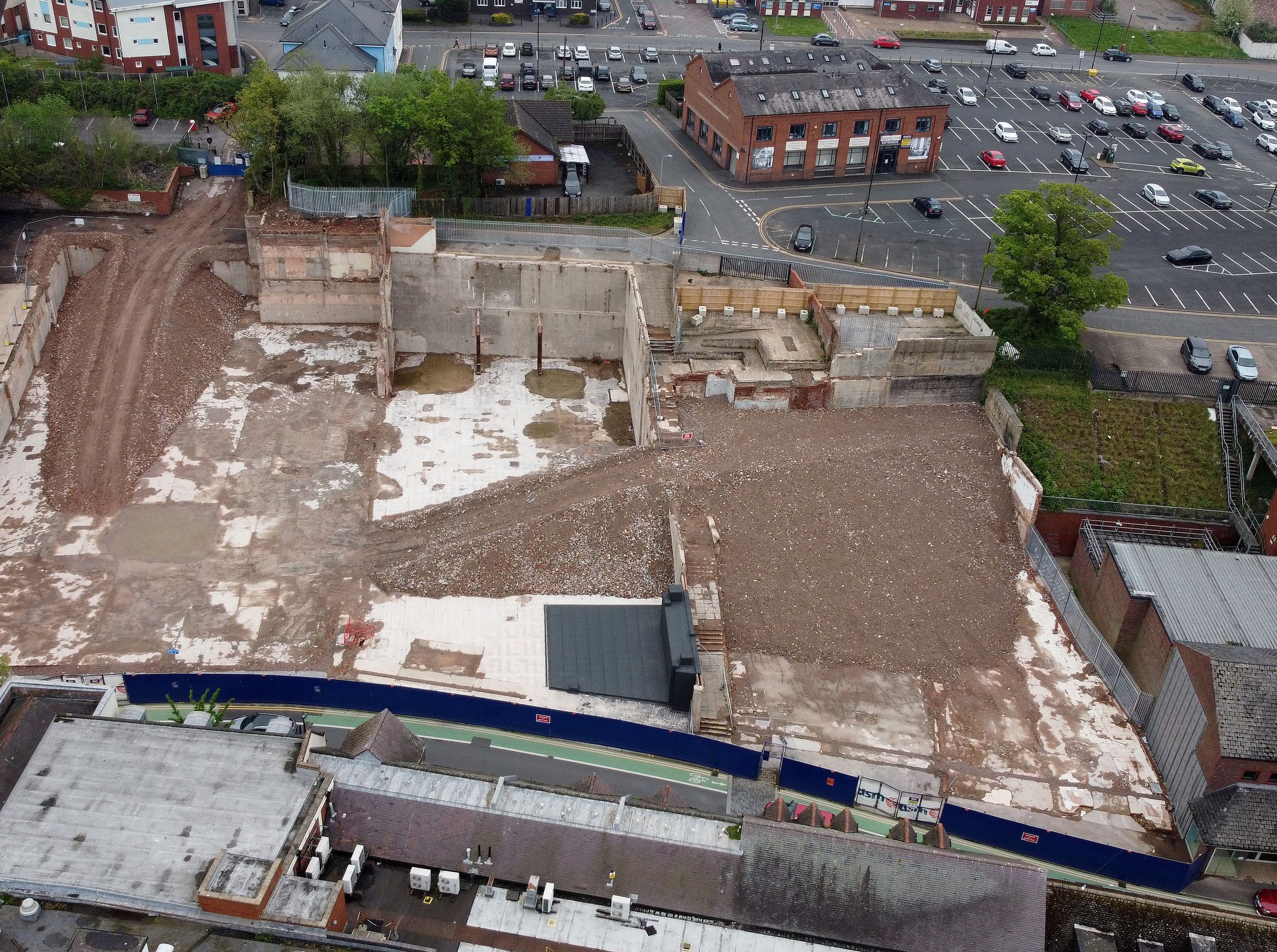 See the former Woolworths that is now a mound of rubble as shops are torn down to make way for park