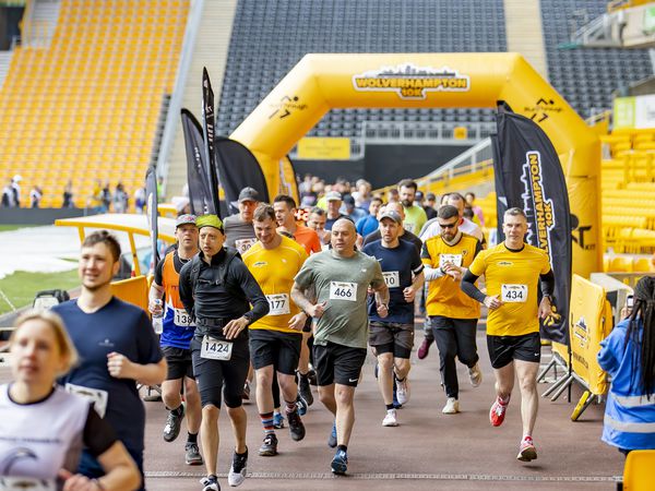 Runners cross the starting line at Molineux