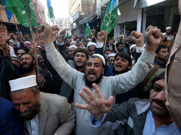 Supporters of Jamaat-e-Islami chant slogans during a protest in Peshawar, Pakistan, against the burning of the Koran, a Muslim holy book, by a Danish anti-islam activist