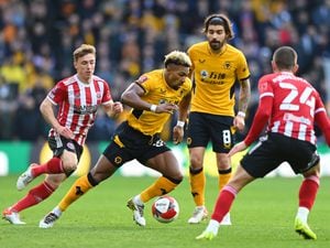 Adama Traore of Wolverhampton Wanderers runs with the ball during the Emirates FA Cup Third Round match between Wolverhampton Wanderers and Sheffield United at Molineux on January 09, 2022 in Wolverhampton, England. (Photo by Sam Bagnall - WWFC/Wolves via Getty Images).