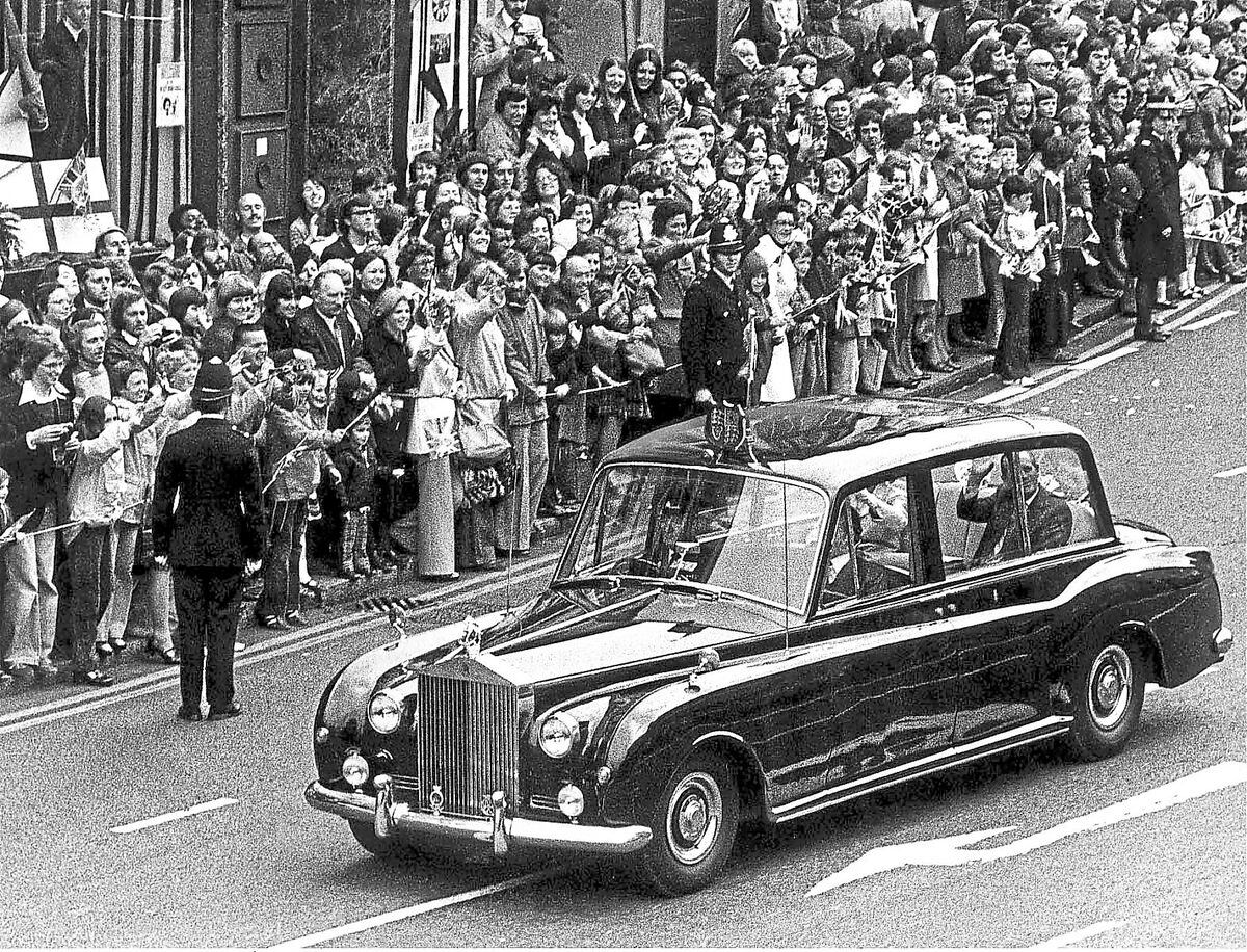 The Queen's Rolls-Royce was pictured sweeping through the streets of Wolverhampton during her Silver Jubilee tour of the West Midlands in 1977. The car broke down at Walsall and mechanics Chris Tate and Fred Budd were called to repair it