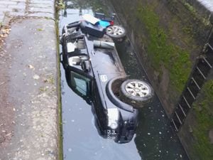 The vehicle fell into the canal lock. Photo: Canal and River Trust
