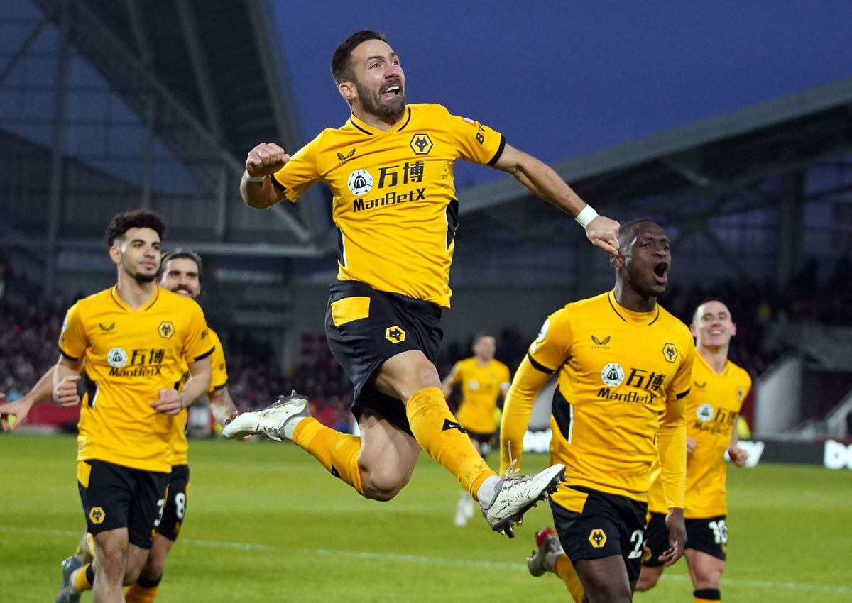 Wolverhampton Wanderers' Joao Moutinho celebrates scoring the opening goal during the Premier League match at Brentford 