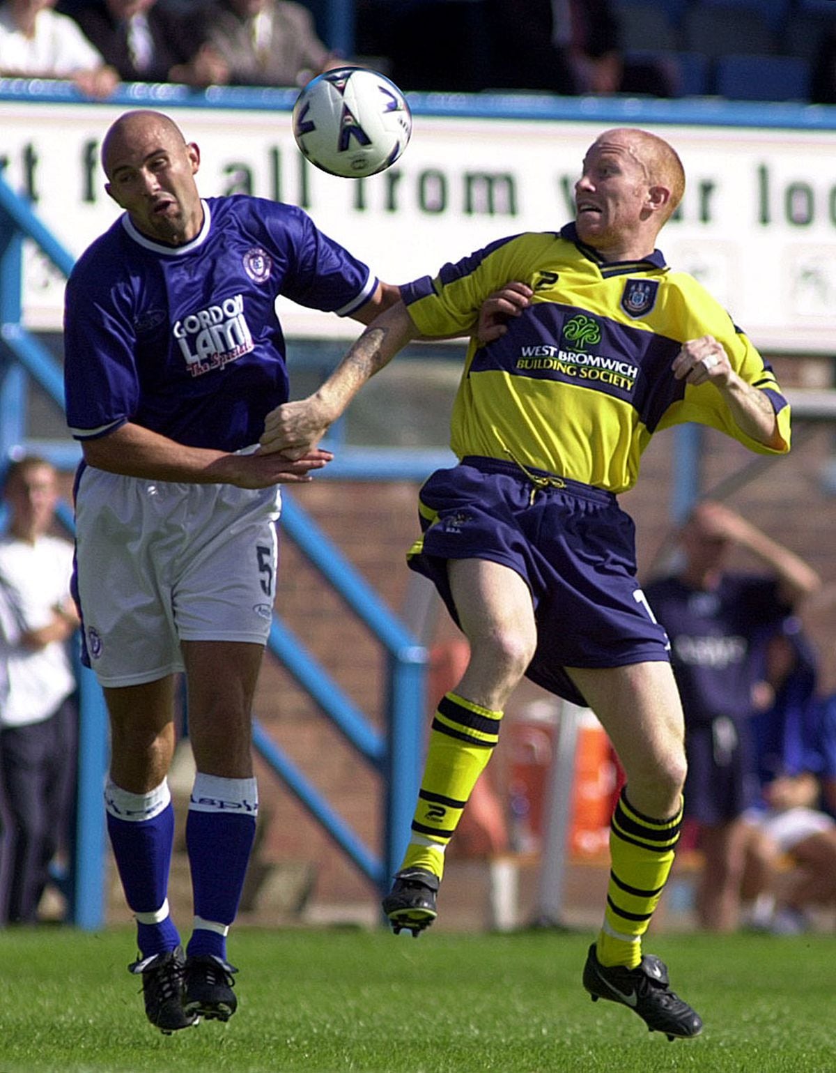 Albion's Lee Hughes challenges for the ball against Chesterfield's Steve Blatherwick at Saltergate. Copyright Express & Star: Paul Turner: 5/8/00: