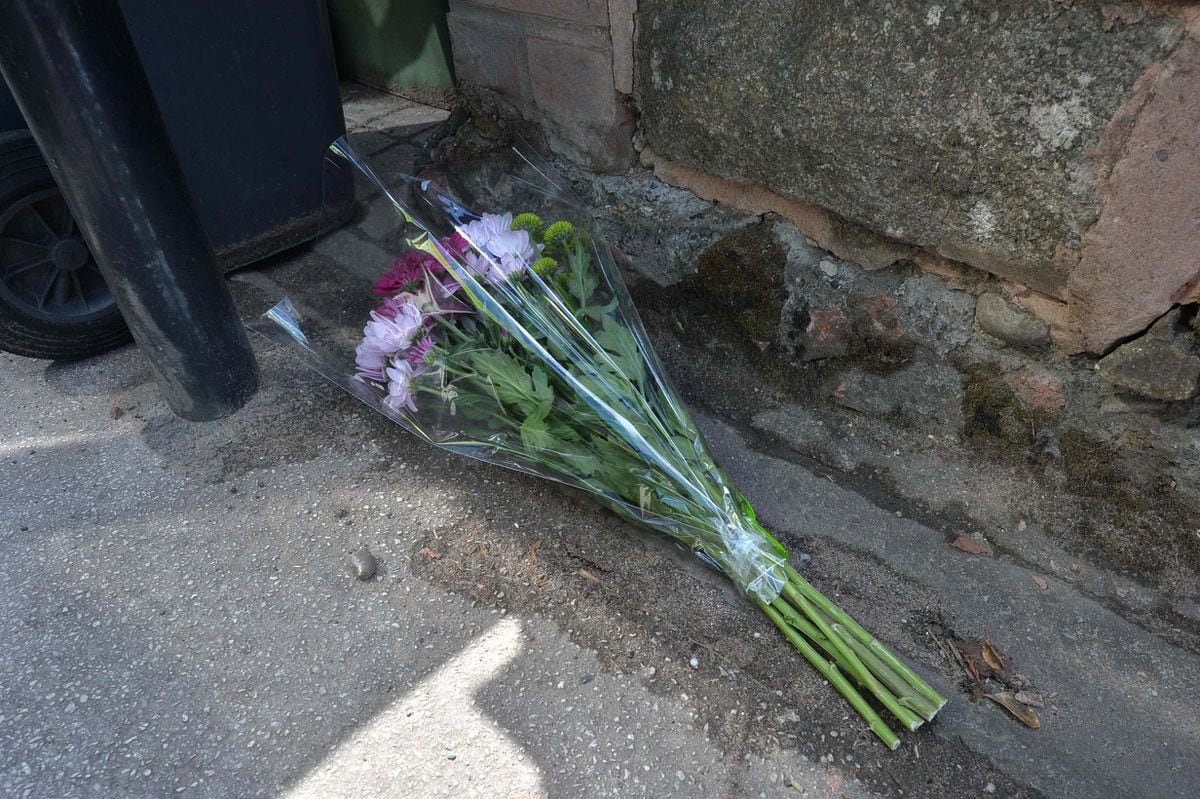 Flowers left in tribute at the scene