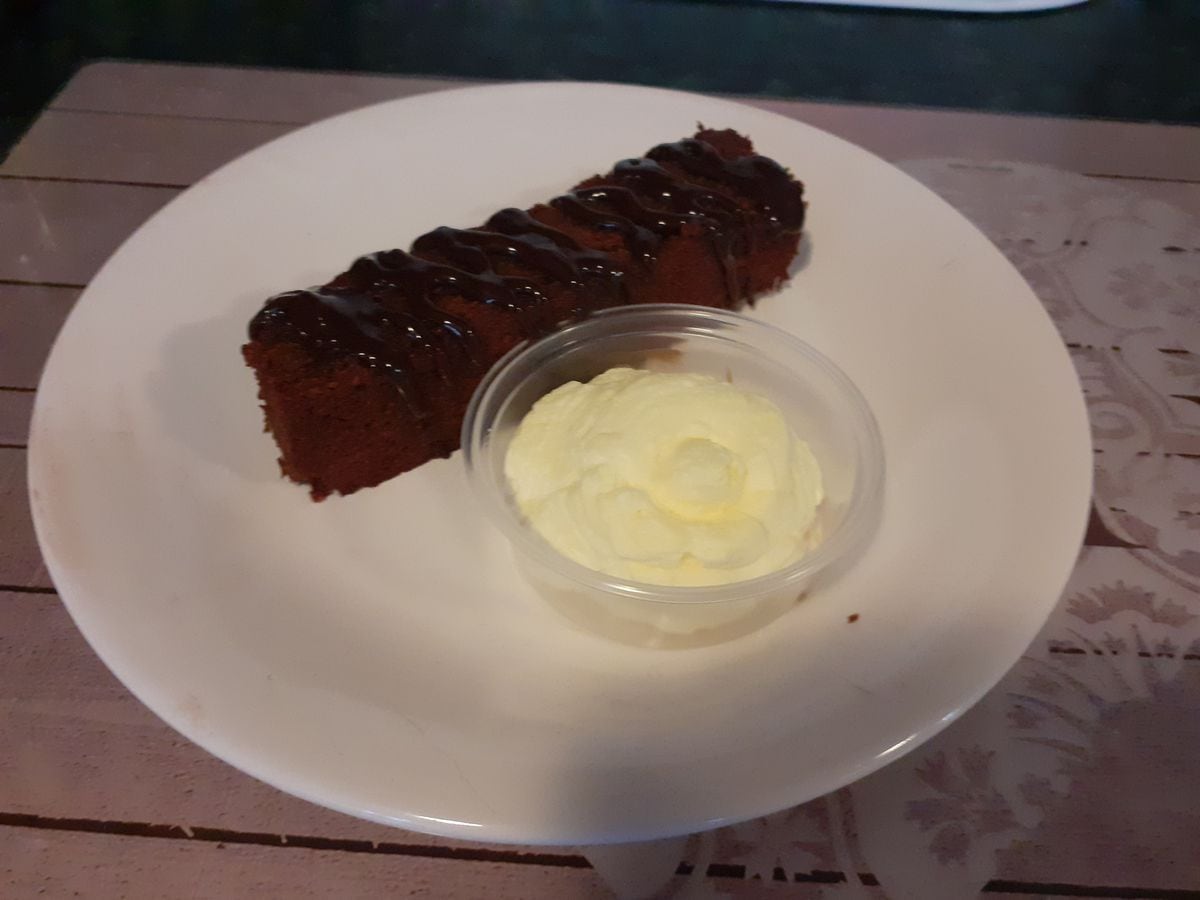 Chocolate slice with whipped cream