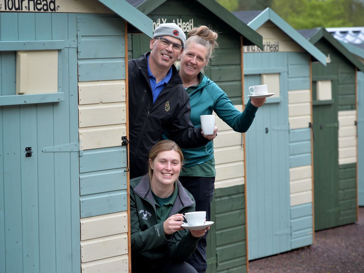 Kaye and Richard Le Page with their daughter Lucy next to one of the forest huts at Springslade Lodge, Cannock Chase.