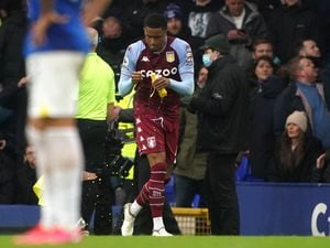               Aston Villa's Ezri Konsa with bottle after it was thrown at celebrating Aston Villa players by Everton fans