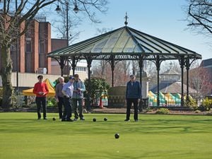 The green has a vivid backdrop, with the Cannock bandstand one of the notable sites