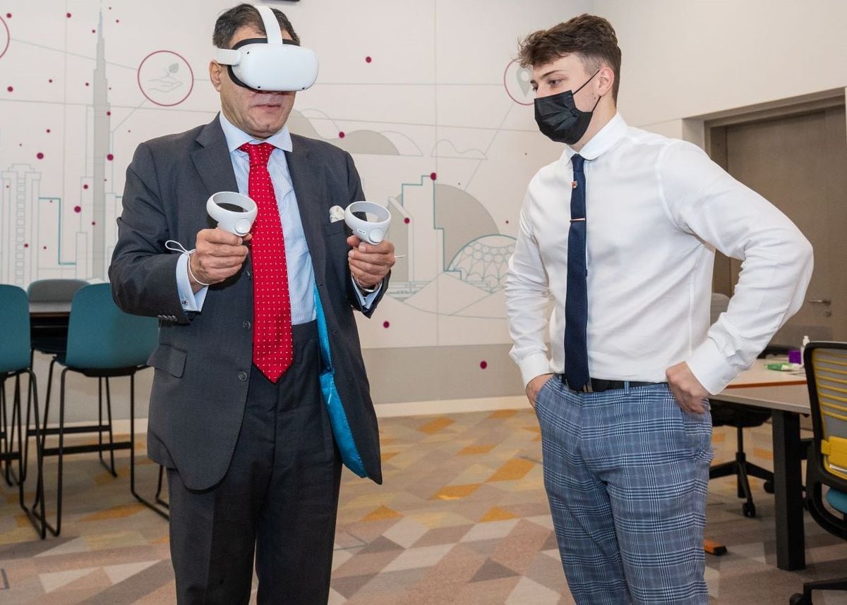 Andy Morrin, right, demonstrates the VR simulator to University of Birmingham Chancellor Lord Karan Bilimoria at the University of Birmingham Dubai campus