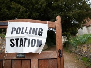 A polling station sign outside a church in Monk Sherborne, Hampshire