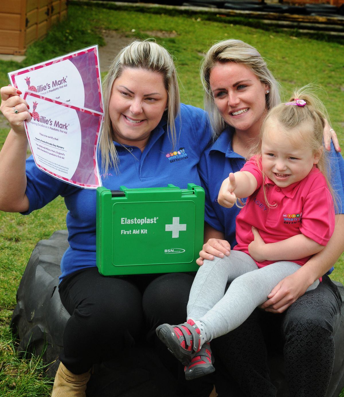 Happy to be awarded Milllie's Mark, (left-right) owner Lydia Browning, of Sedgley, room leader Chelsea Davies, of Dudley, with Macey-Drew Smith, aged 3, of West Bromwich, at Smarty Pants Day Nursery, Tipton.