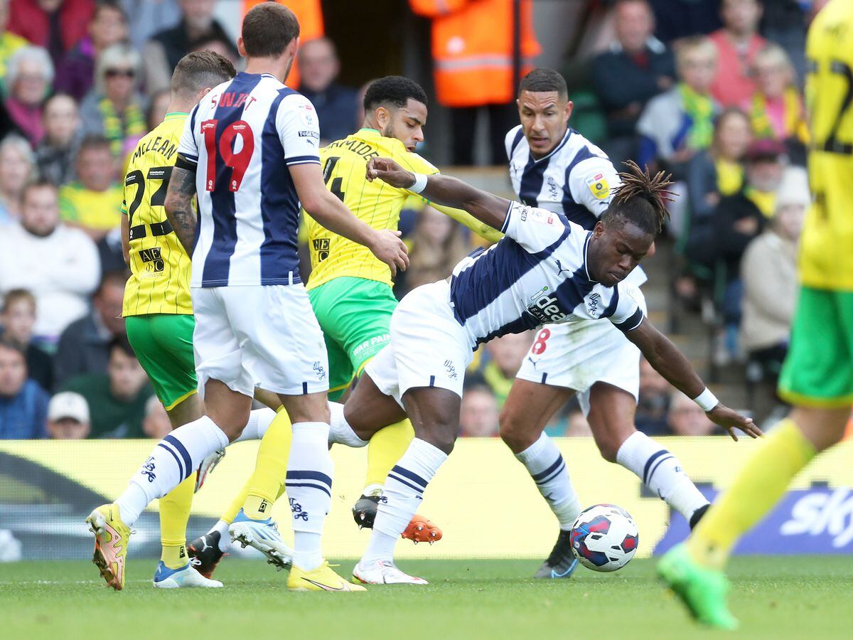 Andrew Omobamidele of Norwich City fouls Brandon Thomas-Asante of West Bromwich Albion during the Sky Bet Championship between Norwich City and West Bromwich Albion at Carrow Road on September 17, 2022 in Norwich, United Kingdom. (Photo by Adam Fradgley/West Bromwich Albion FC via Getty Images).