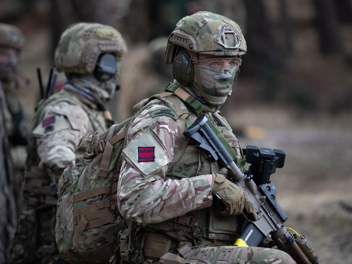 An Army Commando during a live exercise demonstration at Bovington Camp in Dorset.