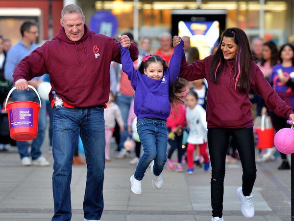 Simon Caulton, partner Anjna Mahey and their inspirational daughter Mia Caulton, aged five, on a fundraising walk in March
