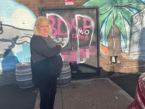 Councillor Tina Jukes surveys the graffiti daubed on the Beechdale mural