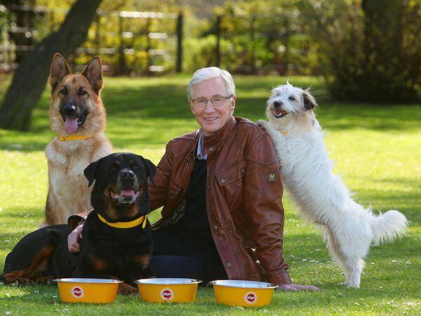 Television personality Paul O’Grady with rescue dogs Razor a German Shepherd, Moose a Rottweiler and Dodger a Terrier at London’s Battersea Park