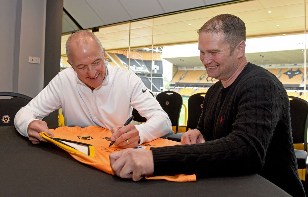 Paul Harrington has his Wolves shirt signed by Bully at Molineux