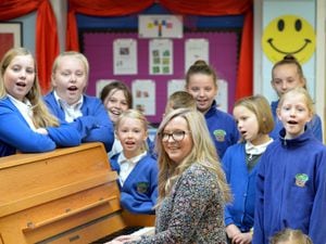 The choir at Landywood primary school, Great Wyrley, reforms. Pictured with students is music lead, Claire Ball.