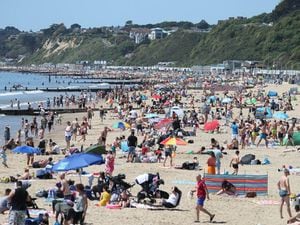 Crowds enjoy the hot weather on Bournemouth beach in Dorset