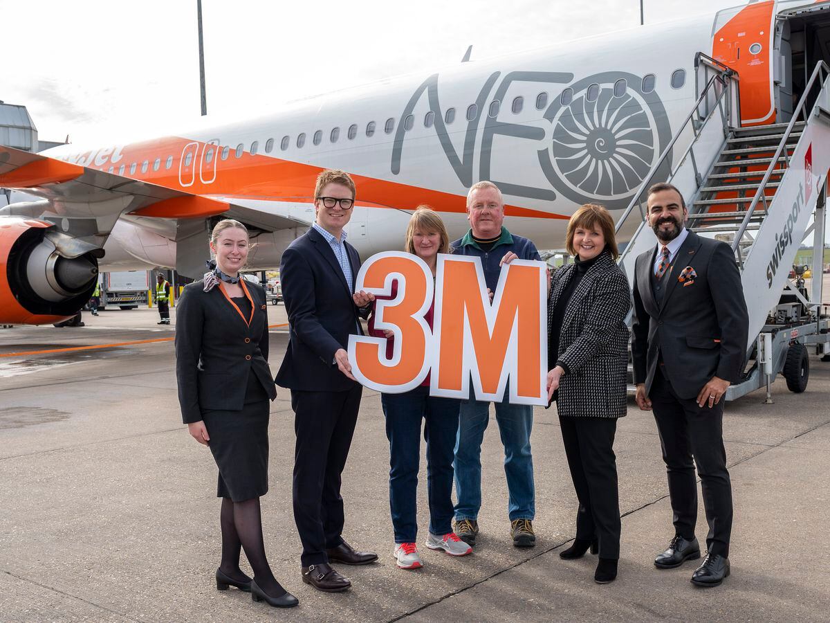 Lucky easyJet travellers Terri and William Powell, centre, from Rowley Regis
