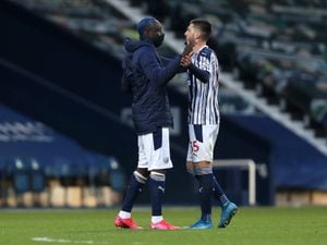 Substituted Mbaye Diagne of West Bromwich Albion comes onto the pitch after the final whistle to celebrate with Okay Yokuslu. (AMA)