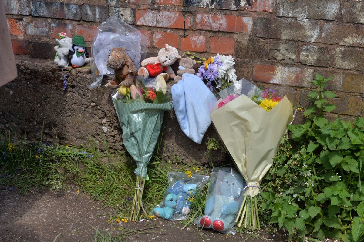 Tributes to the unknown baby were left along the canal