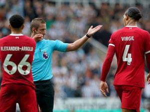 Liverpool's Virgil van Dijk is shown a red card. Picture: Owen Humphreys/PA Wire.