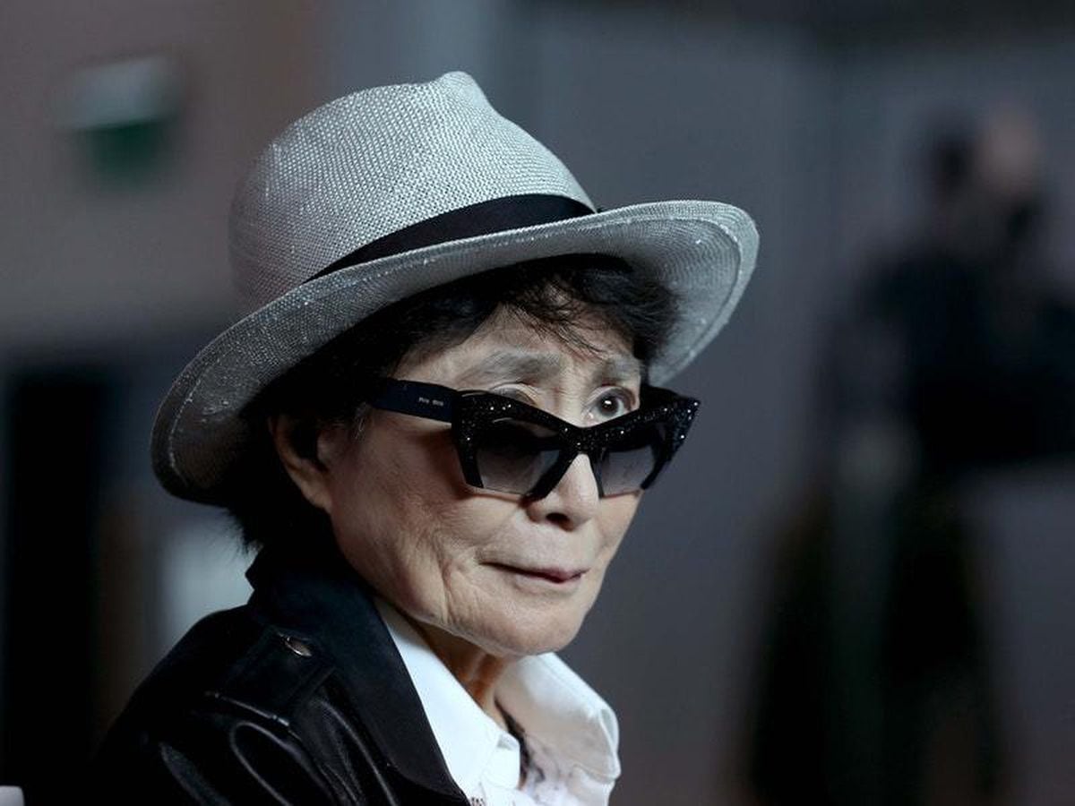 Yoko Ono wearing a hat