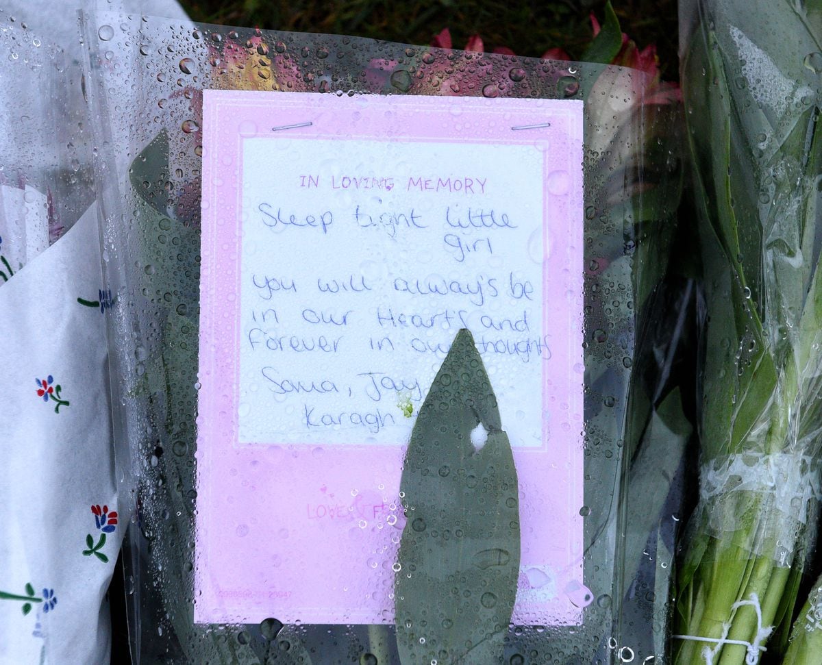 Floral tributes have been laid outside the home