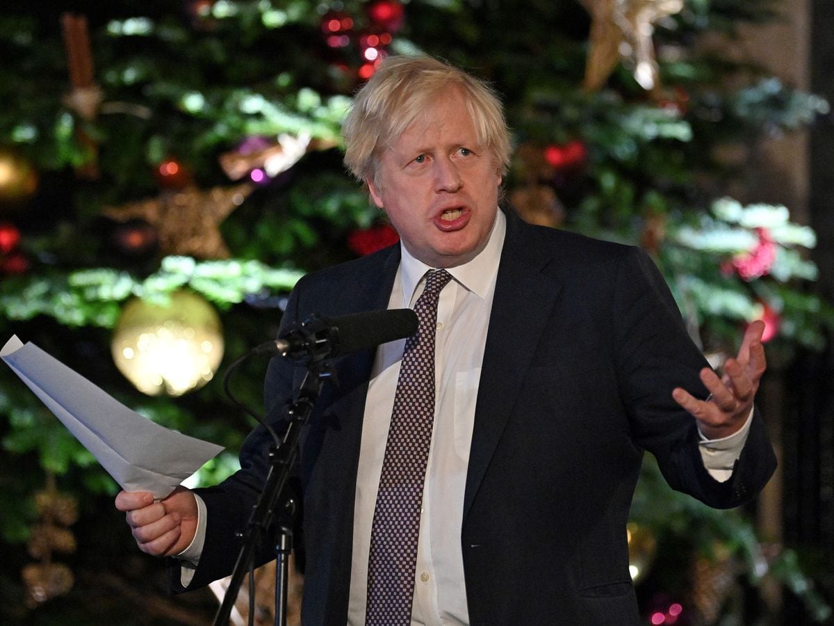 Prime Minister Boris Johnson talking at a Christmas market set up in Downing Street