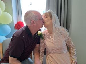 Maureen and Steve kiss on their wedding day. Photo: Walsall Healthcare NHS Trust.