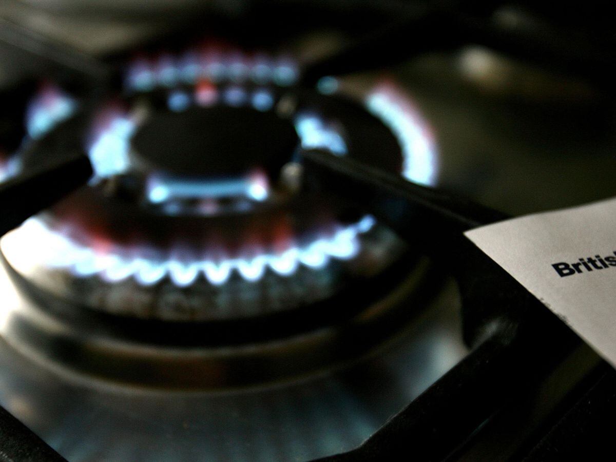 A gas hob beside a British Gas bill
