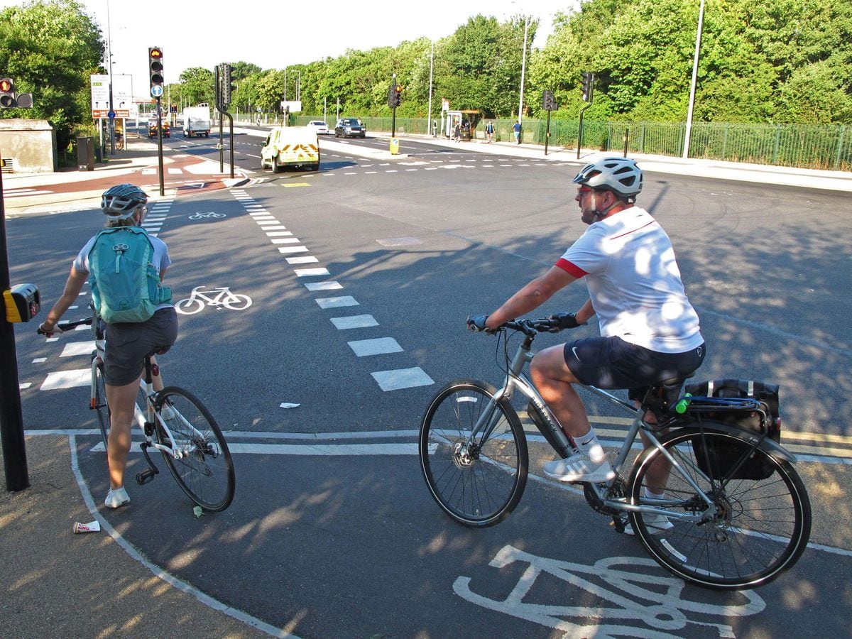 Cyclists use a segregated cycle lane in Waltham Forest, north-east London