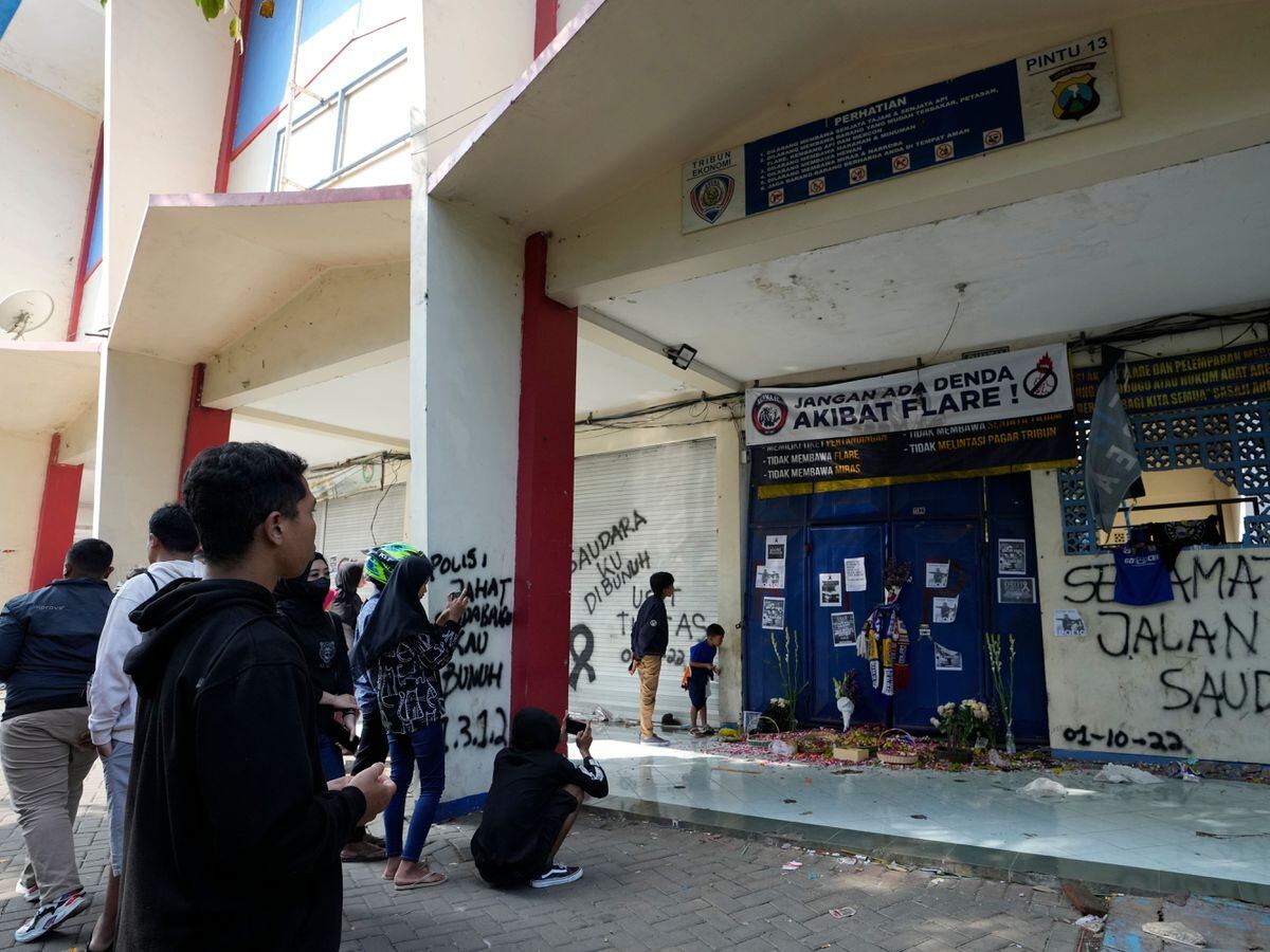 Tributes in front of gate 13 at the Kanjuruhan Stadium in Malang, Indonesia