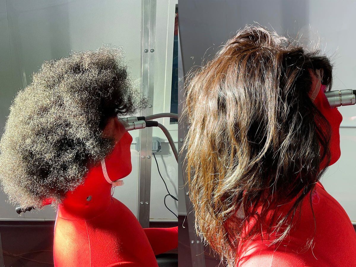 A thermal manikin wearing tightly curled, left, and straight, right, human hair wigs