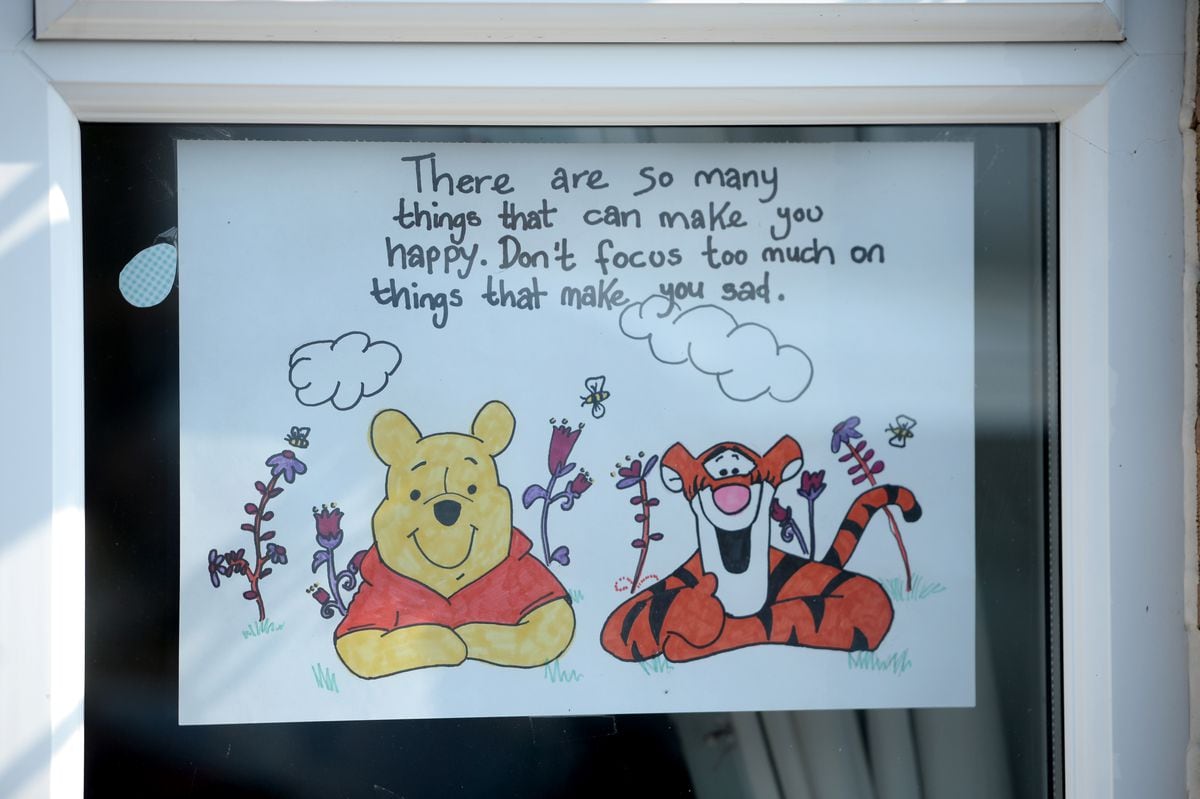 Colourful drawings have been placed in the windows of Mandy Rayner's home.
