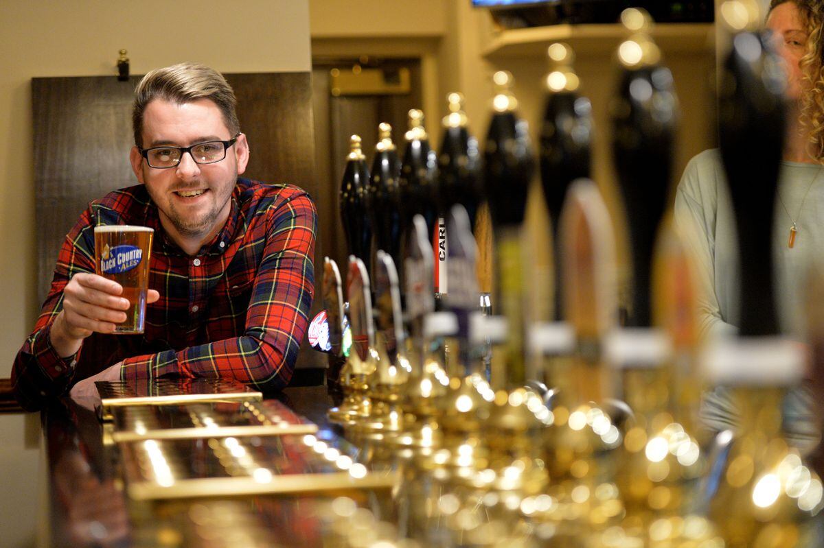 Landlord Michael Lawrence raises a glass at The Horse and Jockey in Penkridge