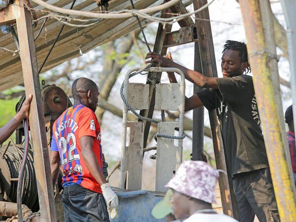A miner assists in the rescue mission in Chegutu