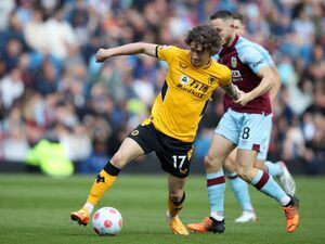 Fabio Silva of Wolverhampton Wanderers is challenged by Josh Brownhill of Burnley during the Premier League match between Burnley and Wolverhampton Wanderers at Turf Moor on April 24, 2022 in Burnley, England. (Photo by Jack Thomas - WWFC/Wolves via Getty Images).