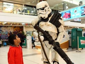 Four-year-old Ashish Gharu meets a Star Wars stormtrooper at GeekCon