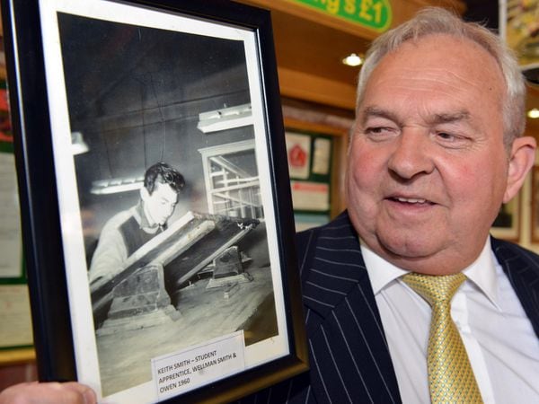 Keith Smith with a picture of himself as an apprentice at Wellman Smith Owen in 1960..