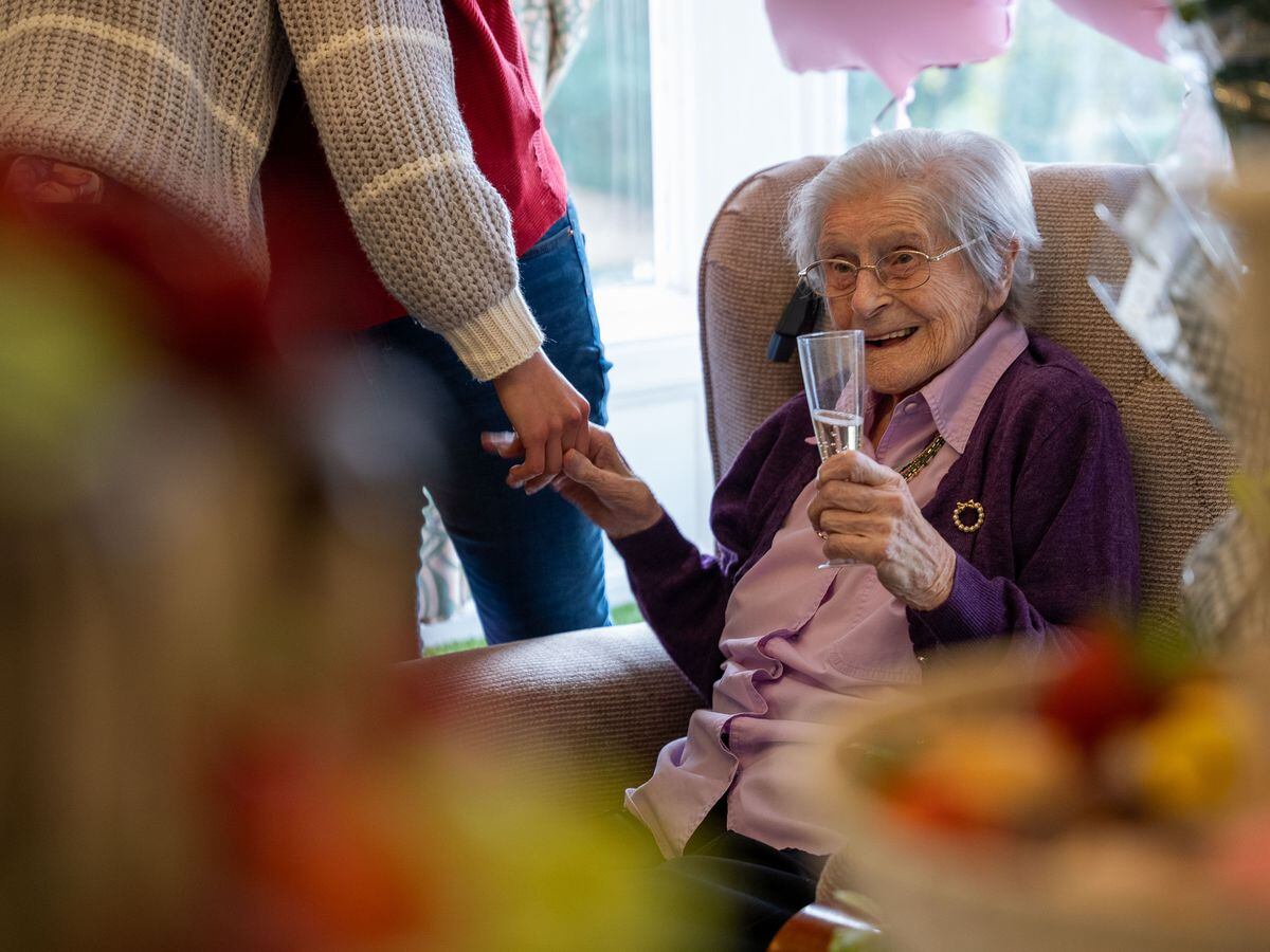 Kathleen Withall enjoys her 103rd birthday party.