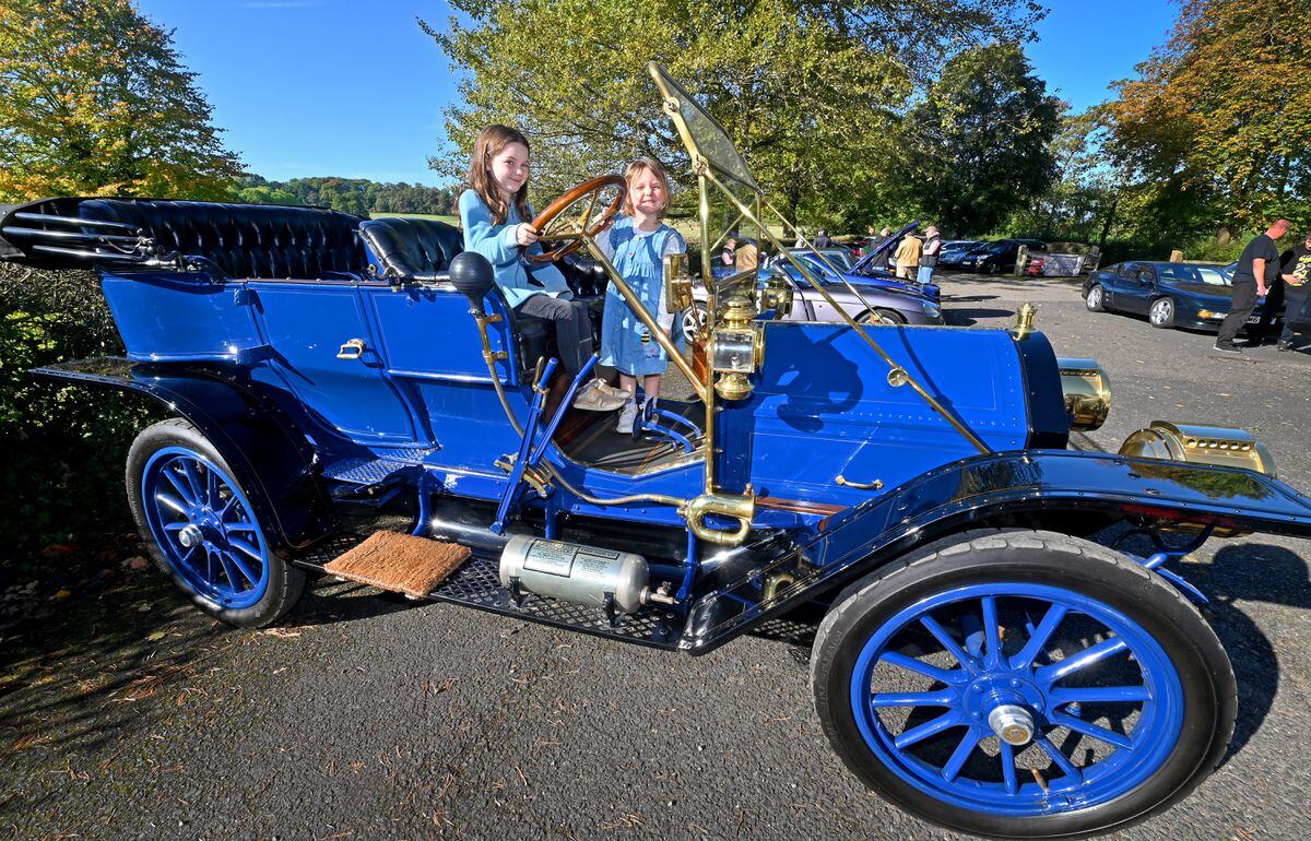 Imogen Parr, aged seven, and sister Alice, aged three, from Wombourne, in a 1909 Cadillac