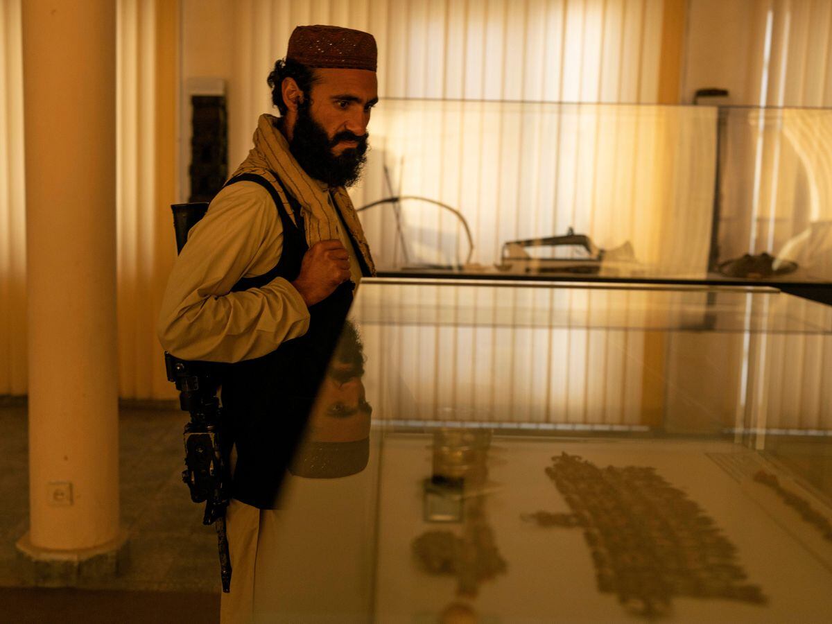 Taliban fighter Mansoor Zulfiqar visits the National Museum of Afghanistan
