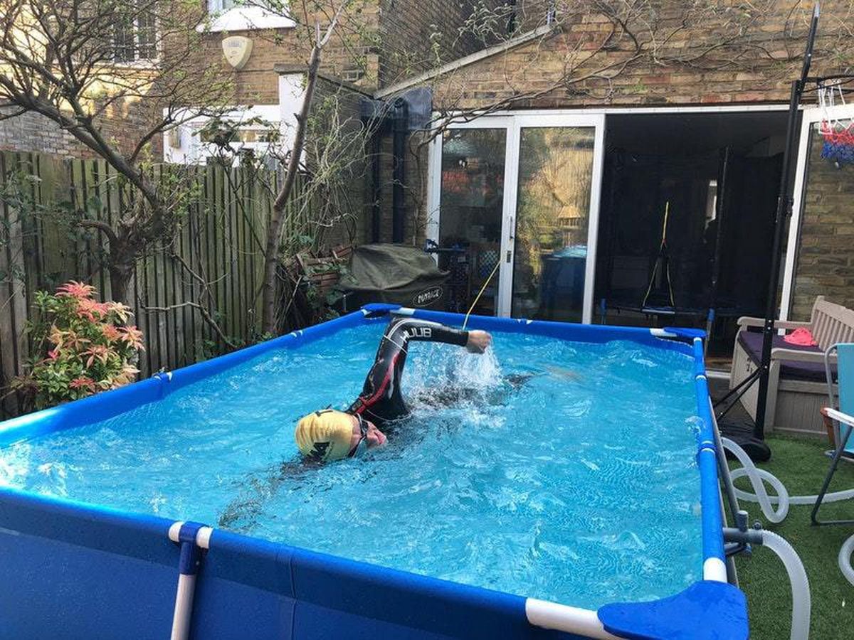 Neil Clark swims in a three-metre pool in his back garden