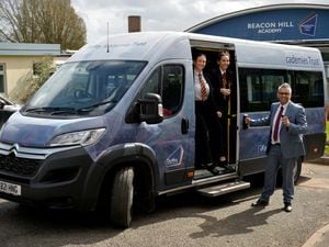 Beacon Hill Academy in Sedgley is helping students get to school during the bus strikes by picking them up using their two minibuses. Pictured: Principal Sukhjot Dhami with students